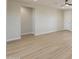 Open-concept living room with modern floors and neutral paint colors at 57856 W Fulcar Rd, Maricopa, AZ 85139