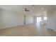 Bright and airy living room featuring modern flooring and recessed lighting at 57856 W Fulcar Rd, Maricopa, AZ 85139