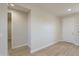 This room showcases plank floors and recessed lighting, creating a clean, modern space at 57856 W Fulcar Rd, Maricopa, AZ 85139