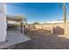 View of the backyard showing patio, rock cover, and block wall at 638 W 16Th St, Tempe, AZ 85281