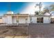 Spacious backyard features a covered patio, crisp white walls, and low-maintenance gravel landscaping at 638 W 16Th St, Tempe, AZ 85281