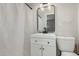 Bathroom with a modern black framed mirror, white cabinets, and coordinated fixtures at 638 W 16Th St, Tempe, AZ 85281