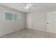 Bright bedroom with a ceiling fan, carpet, and a window at 638 W 16Th St, Tempe, AZ 85281