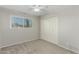 Bedroom showcasing neutral colored walls, a ceiling fan, new carpet, and a window at 638 W 16Th St, Tempe, AZ 85281