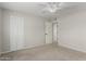 Comfortable bedroom features carpet, a ceiling fan, and a closet at 638 W 16Th St, Tempe, AZ 85281