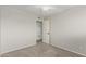 View of a bedroom featuring neutral walls, a ceiling fan, new carpet, and closet access at 638 W 16Th St, Tempe, AZ 85281