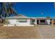 Charming single-story white home featuring a covered parking area and a well-lit entrance at 638 W 16Th St, Tempe, AZ 85281