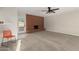 Spacious living room with neutral carpet, ceiling fan, and brick fireplace at 638 W 16Th St, Tempe, AZ 85281