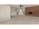 Open-concept living room with neutral carpet, ceiling fan, and brick fireplace at 638 W 16Th St, Tempe, AZ 85281