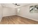 Bedroom featuring a ceiling fan, a large windows, and wood-look floors at 6926 E Moreland St, Scottsdale, AZ 85257