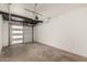 Empty garage provides plenty of room for parking and storage with an automatic door at 6926 E Moreland St, Scottsdale, AZ 85257