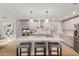Spacious kitchen features stainless appliances, modern gray cabinets and marble countertops at 6926 E Moreland St, Scottsdale, AZ 85257
