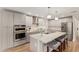 Spacious kitchen features stainless appliances, modern gray cabinets and marble countertops at 6926 E Moreland St, Scottsdale, AZ 85257