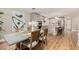 Modern eat-in kitchen boasts stainless appliances, gray cabinets, and a spacious island with bar stool seating at 6926 E Moreland St, Scottsdale, AZ 85257