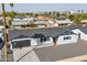 Single-story home with a basketball hoop, covered front porch and gravel landscaping at 7014 E Latham St, Scottsdale, AZ 85257