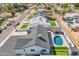 Aerial view of backyard with putting green, backyard pool and covered patio at 7014 E Latham St, Scottsdale, AZ 85257