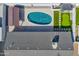 Aerial view of backyard with pool, putting green, and covered patio at 7014 E Latham St, Scottsdale, AZ 85257