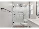 Elegant bathroom with a modern glass shower, black fixtures, and a clean, minimalist design at 7014 E Latham St, Scottsdale, AZ 85257