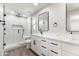 Modern bathroom with dual vanity, sleek black hardware, and a luxurious walk-in shower at 7014 E Latham St, Scottsdale, AZ 85257