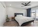 A spacious bedroom features a ceiling fan and glass doors to the pool area at 7014 E Latham St, Scottsdale, AZ 85257