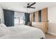 Spacious primary bedroom featuring modern decor, wood-look floors, and backyard views at 7014 E Latham St, Scottsdale, AZ 85257