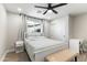 Inviting bedroom featuring a neutral color scheme, white bed frame and bench at 7014 E Latham St, Scottsdale, AZ 85257