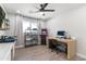 Game room with hardwood floors, ceiling fan, and large picture window at 7014 E Latham St, Scottsdale, AZ 85257
