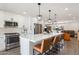 Stylish kitchen features modern countertops, stainless appliances, a spacious island and backyard views at 7014 E Latham St, Scottsdale, AZ 85257