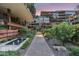 Beautiful courtyard and walkway between buildings, with lush landscaping, fountain, and sunset at 7137 E Rancho Vista Dr # 5001, Scottsdale, AZ 85251