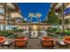 Upscale complex featuring a pond with fountains, seating area, palm trees, and multiple stories at 7137 E Rancho Vista Dr # 5001, Scottsdale, AZ 85251
