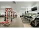 Well-equipped gym featuring treadmills, step machine, weight-lifting machines, and free weights at 7137 E Rancho Vista Dr # 5001, Scottsdale, AZ 85251