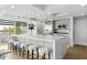 Modern open kitchen featuring a large island, stainless steel appliances, seating and an abundance of natural light at 7137 E Rancho Vista Dr # 5001, Scottsdale, AZ 85251