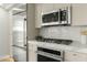 Close up on modern appliances and light-colored cabinets in an updated kitchen at 7137 E Rancho Vista Dr # 5001, Scottsdale, AZ 85251