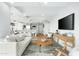 Bright living room featuring a modern sofa, stylish rug, and open floor plan leading to the kitchen at 7137 E Rancho Vista Dr # 5001, Scottsdale, AZ 85251