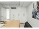 Bright office featuring built-in white cabinets and a light wood desk with a large window at 7137 E Rancho Vista Dr # 5001, Scottsdale, AZ 85251