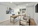 Bright office featuring a large window, light wood desk, neutral tones, and modern design elements at 7137 E Rancho Vista Dr # 5001, Scottsdale, AZ 85251
