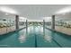 Resort-style indoor pool area with lane markers, large windows, and ample lounge seating at 7137 E Rancho Vista Dr # 5001, Scottsdale, AZ 85251