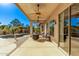 Spacious covered patio next to pool, offering seamless transition between indoor and outdoor living areas at 7223 W Saddlehorn Rd, Peoria, AZ 85383