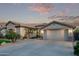 Beautiful single-Gathering home boasting a well-manicured lawn, desert landscaping, and a spacious two-car garage at 7223 W Saddlehorn Rd, Peoria, AZ 85383