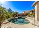 Backyard oasis featuring a sparkling pool with well-maintained landscaping and clear blue skies at 7223 W Saddlehorn Rd, Peoria, AZ 85383