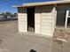 View of the shed with sliding door and concrete slab at 7615 W Palmaire Ave, Glendale, AZ 85303