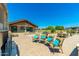 A large backyard with a pool, outdoor seating, and barbeque area at 7738 N 185Th Ave, Waddell, AZ 85355