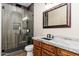 Nicely finished bathroom featuring a glass shower, granite counter tops and wood cabinets at 7738 N 185Th Ave, Waddell, AZ 85355