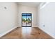 Spacious bedroom with sliding glass door leading to an outdoor patio at 7738 N 185Th Ave, Waddell, AZ 85355