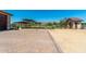 Expansive property featuring horse enclosures, a wash rack, and well-maintained grounds with mountain views at 7738 N 185Th Ave, Waddell, AZ 85355