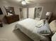 Bedroom with a ceiling fan, dresser, and a doorway to the bathroom at 8020 E Keats Ave # 308, Mesa, AZ 85209