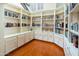 Library with custom built-in bookshelves and rich hardwood floors at 8373 S Forest Ave, Tempe, AZ 85284
