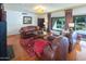 Comfortable living room featuring hardwood floors and leather furniture with ample seating at 8373 S Forest Ave, Tempe, AZ 85284