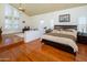 Bright main bedroom with hardwood floors, vaulted ceilings, and comfortable seating area at 8373 S Forest Ave, Tempe, AZ 85284