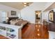 Spacious main bedroom featuring wood floors, large windows, and en-suite bathroom at 8373 S Forest Ave, Tempe, AZ 85284